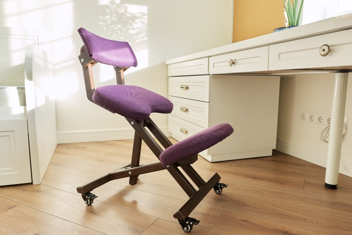 https://www.arteil.com.au/wp-content/uploads/2022/11/kneeling-office-chair-purple.jpg